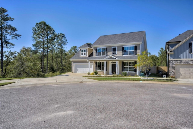 view of front of property featuring a porch and a garage