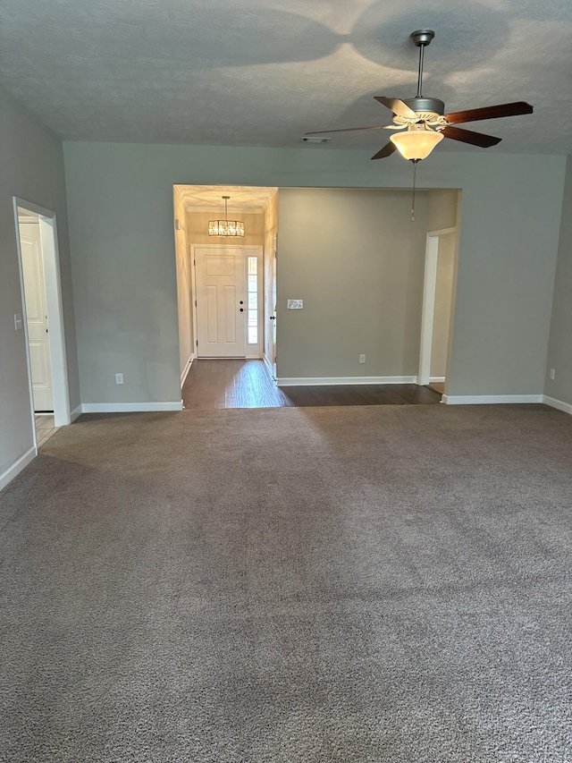 5186 Copse Dr, Augusta, GA 30909 - unfurnished living room featuring dark carpet and a ceiling fan