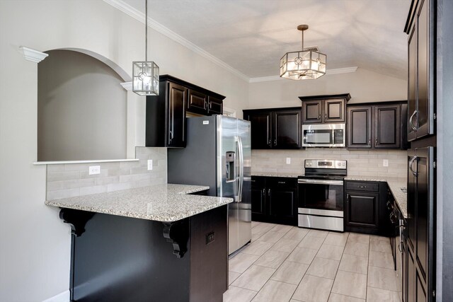 5186 Copse Dr, Augusta, GA 30909 - kitchen with appliances with stainless steel finishes, a peninsula, backsplash, decorative light fixtures, and crown molding