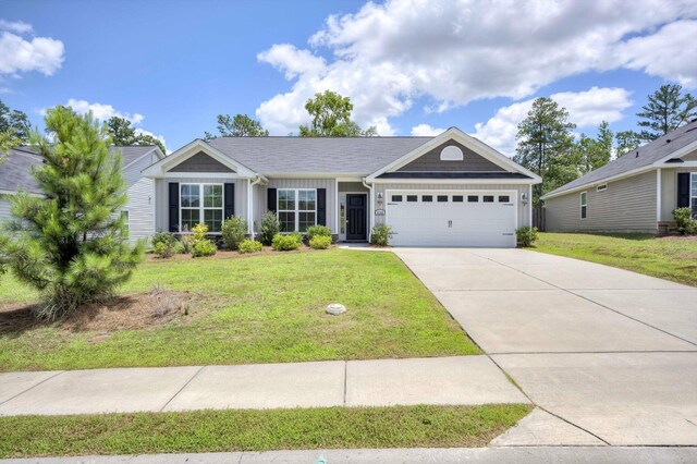 5186 Copse Dr, Augusta, GA 30909 - ranch-style home with a garage, a front lawn, concrete driveway, and board and batten siding
