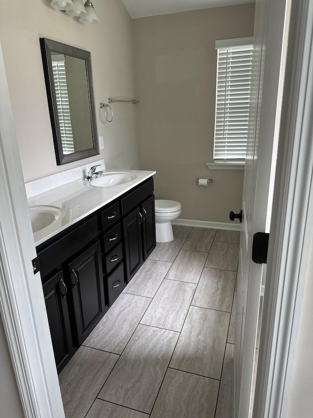 5186 Copse Dr, Augusta, GA 30909 - bathroom featuring double vanity and toilet