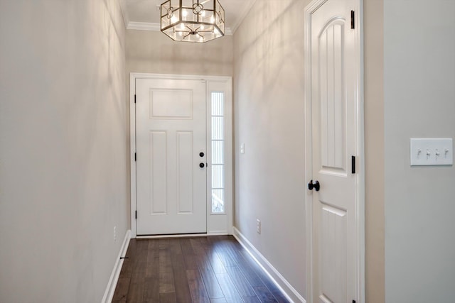 5186 Copse Dr, Augusta, GA 30909 - foyer entrance featuring crown molding, dark wood finished floors, and a chandelier