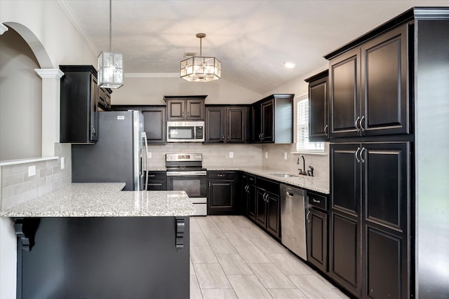 5186 Copse Dr, Augusta, GA 30909 - kitchen with appliances with stainless steel finishes, a peninsula, arched walkways, backsplash, and crown molding