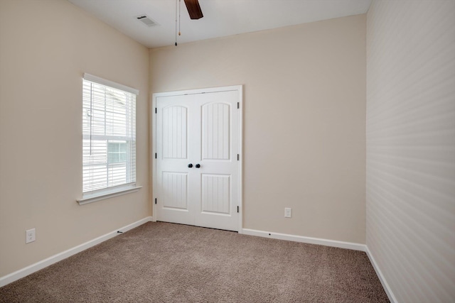 5186 Copse Dr, Augusta, GA 30909 - unfurnished bedroom featuring carpet flooring, a closet, and a ceiling fan