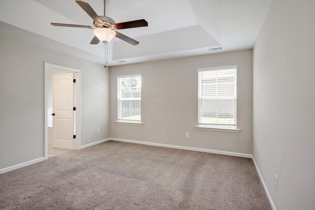 5186 Copse Dr, Augusta, GA 30909 - unfurnished room with light colored carpet, ceiling fan, and a tray ceiling