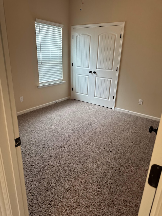 5186 Copse Dr, Augusta, GA 30909 - unfurnished bedroom featuring carpet flooring and a closet
