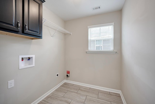 5186 Copse Dr, Augusta, GA 30909 - laundry room featuring electric dryer hookup, hookup for a washing machine, and cabinet space
