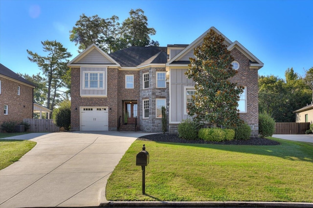 view of front of home with a garage and a front lawn