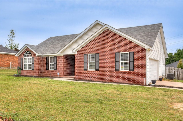 view of front facade with a garage, a front yard, and central AC