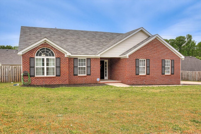 single story home with a front yard