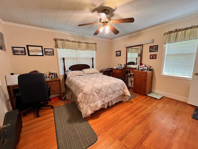 bedroom with multiple windows, light wood-style flooring, and ornamental molding