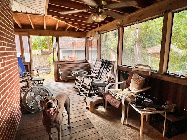 sunroom / solarium featuring vaulted ceiling and a ceiling fan