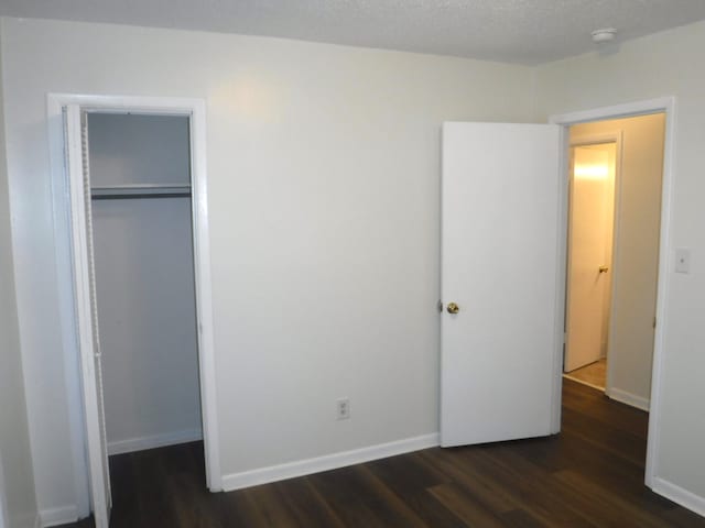 402 Parliment Rd, Martinez, GA 30907 - unfurnished bedroom featuring dark wood-type flooring and a closet