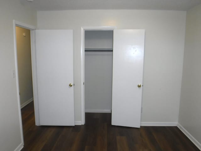 402 Parliment Rd, Martinez, GA 30907 - unfurnished bedroom with wood finished floors and a closet