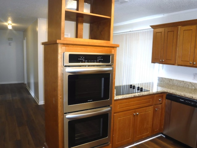 402 Parliment Rd, Martinez, GA 30907 - kitchen featuring stainless steel appliances, dark wood finished floors, brown cabinetry, light stone countertops, and a textured ceiling