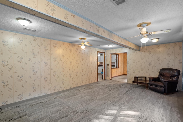 3626 Langdon Dr, Augusta, GA 30906 - living area featuring a ceiling fan, a textured ceiling, wallpapered walls, and wood finished floors