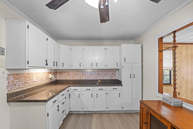 3626 Langdon Dr, Augusta, GA 30906 - kitchen featuring light wood-style floors, a textured ceiling, dark countertops, ceiling fan, and backsplash
