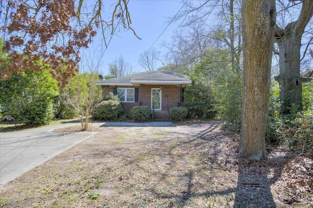 view of front of house featuring brick siding