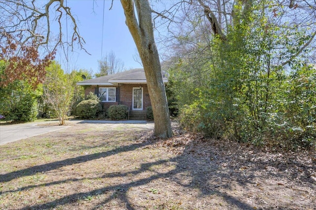 view of front of house with brick siding