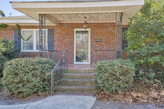 entrance to property with brick siding