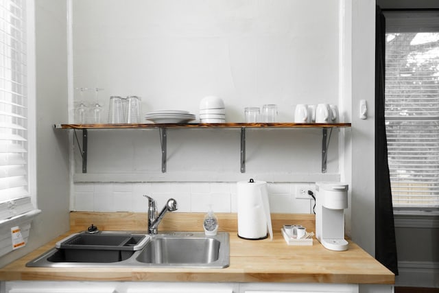 kitchen with tasteful backsplash and sink