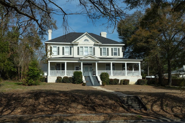 view of front of property featuring covered porch