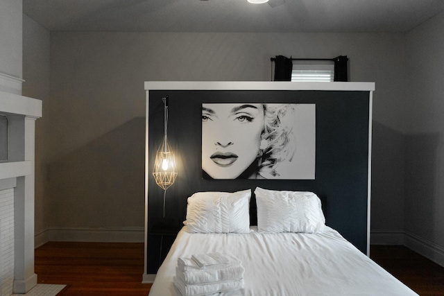 bedroom featuring dark hardwood / wood-style flooring