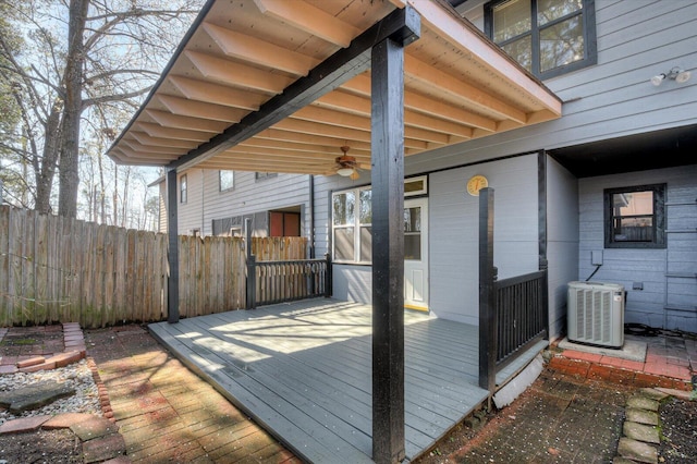 wooden deck with central air condition unit, a ceiling fan, and fence