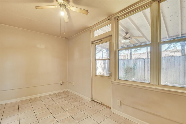 unfurnished room with light tile patterned floors, baseboards, and a ceiling fan