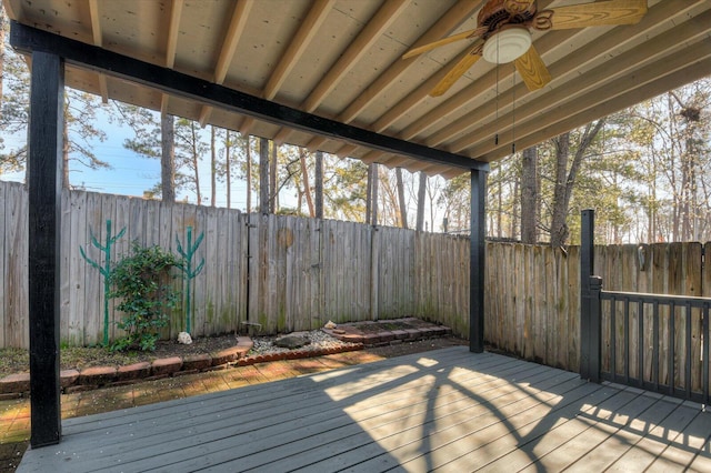 deck featuring ceiling fan and a fenced backyard