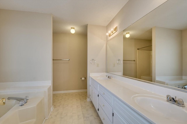 full bath featuring a bath, double vanity, walk in shower, and a sink