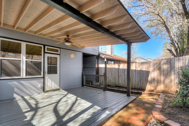 wooden deck featuring a ceiling fan and fence