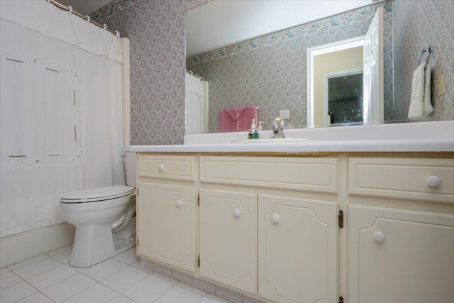 bathroom featuring vanity, toilet, tile patterned flooring, and wallpapered walls