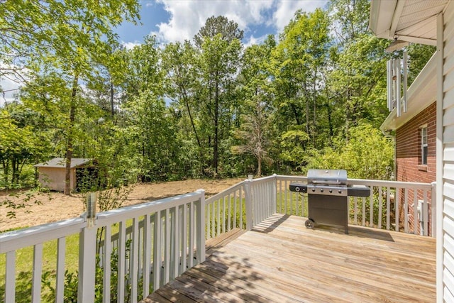 wooden terrace featuring grilling area