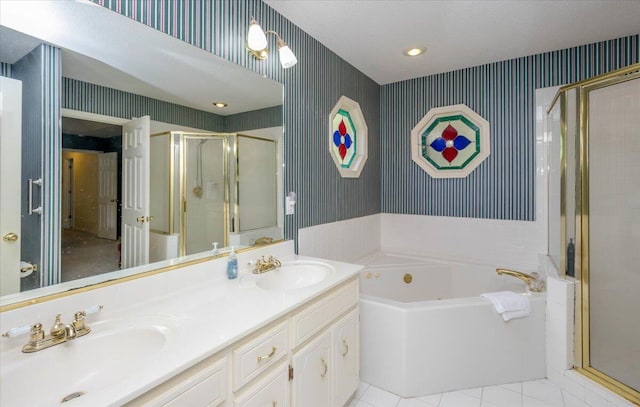 full bath featuring a stall shower, a sink, and wallpapered walls