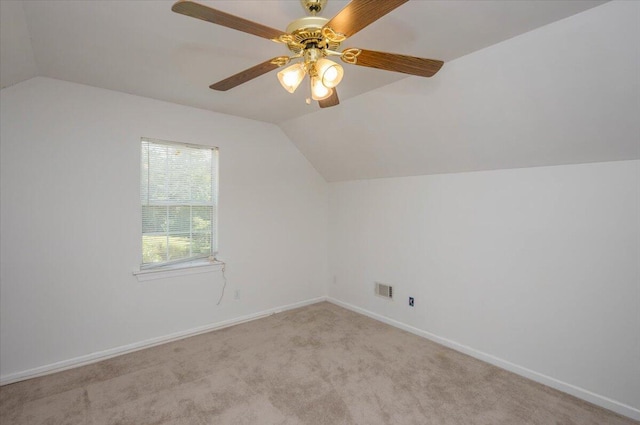 additional living space with baseboards, ceiling fan, carpet, and vaulted ceiling