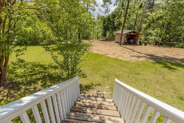 view of yard with a storage shed and an outbuilding