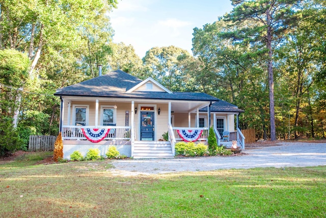 bungalow-style house with a porch and a front yard