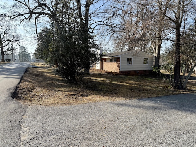 view of home's exterior featuring aphalt driveway