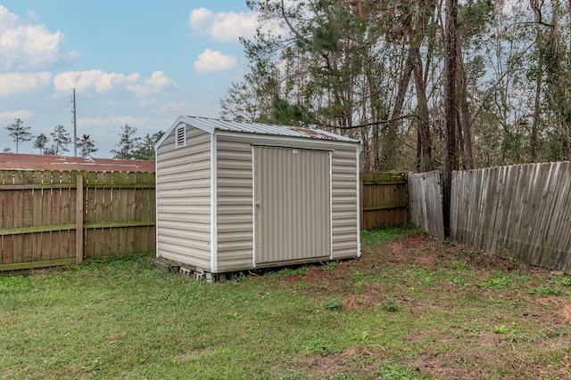 view of outbuilding featuring a lawn