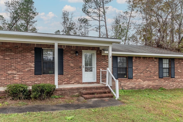 ranch-style house with a front lawn