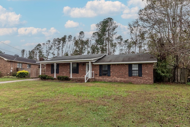 single story home with a front yard