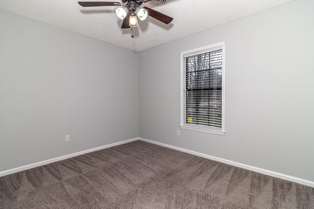 unfurnished room featuring ceiling fan, carpet, and a textured ceiling