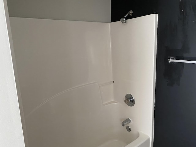 bathroom with shower / washtub combination