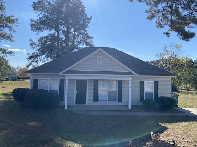 view of front of house featuring a front yard and a porch