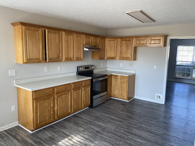 kitchen featuring dark hardwood / wood-style floors, stainless steel electric range oven, and a textured ceiling