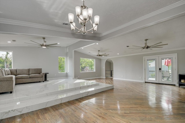 2417 Wilkshire Dr, Augusta, GA 30904 - unfurnished living room with ornamental molding, baseboards, arched walkways, visible vents, and wood finished floors