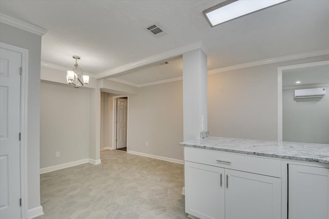 2417 Wilkshire Dr, Augusta, GA 30904 - interior space with visible vents, crown molding, baseboards, an inviting chandelier, and an AC wall unit