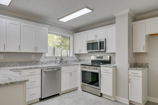 2417 Wilkshire Dr, Augusta, GA 30904 - kitchen featuring a sink, white cabinetry, ornamental molding, and appliances with stainless steel finishes
