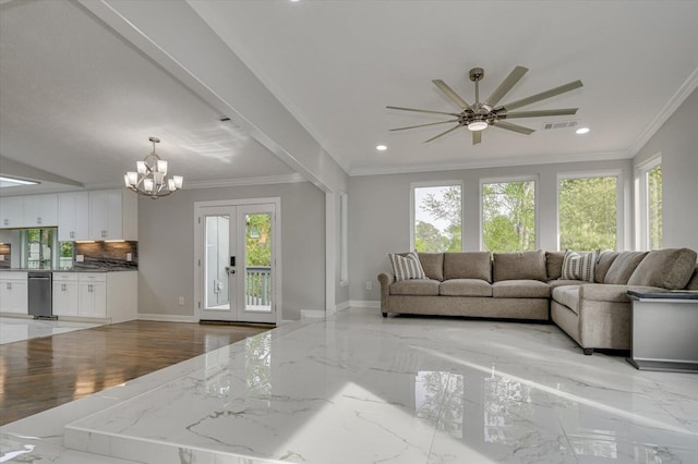 2417 Wilkshire Dr, Augusta, GA 30904 - living area featuring marble finish floor, ornamental molding, visible vents, and ceiling fan with notable chandelier